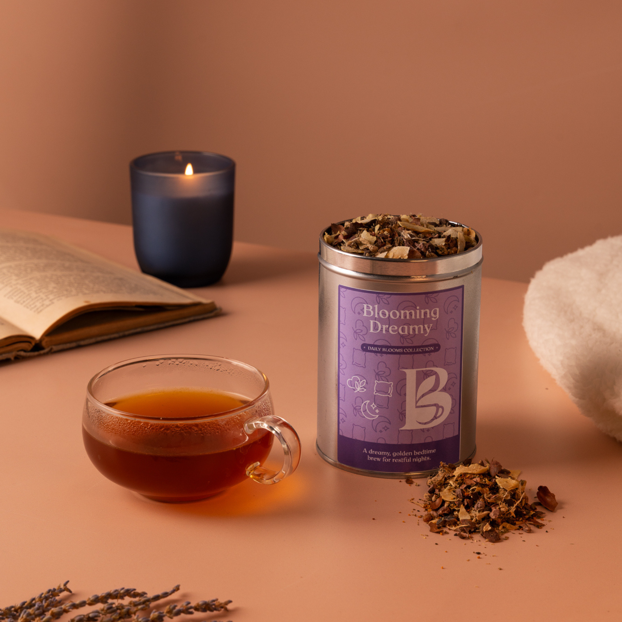 Blooming Dreamy loose leaf golden tea with glass cup and candle for evening wind down