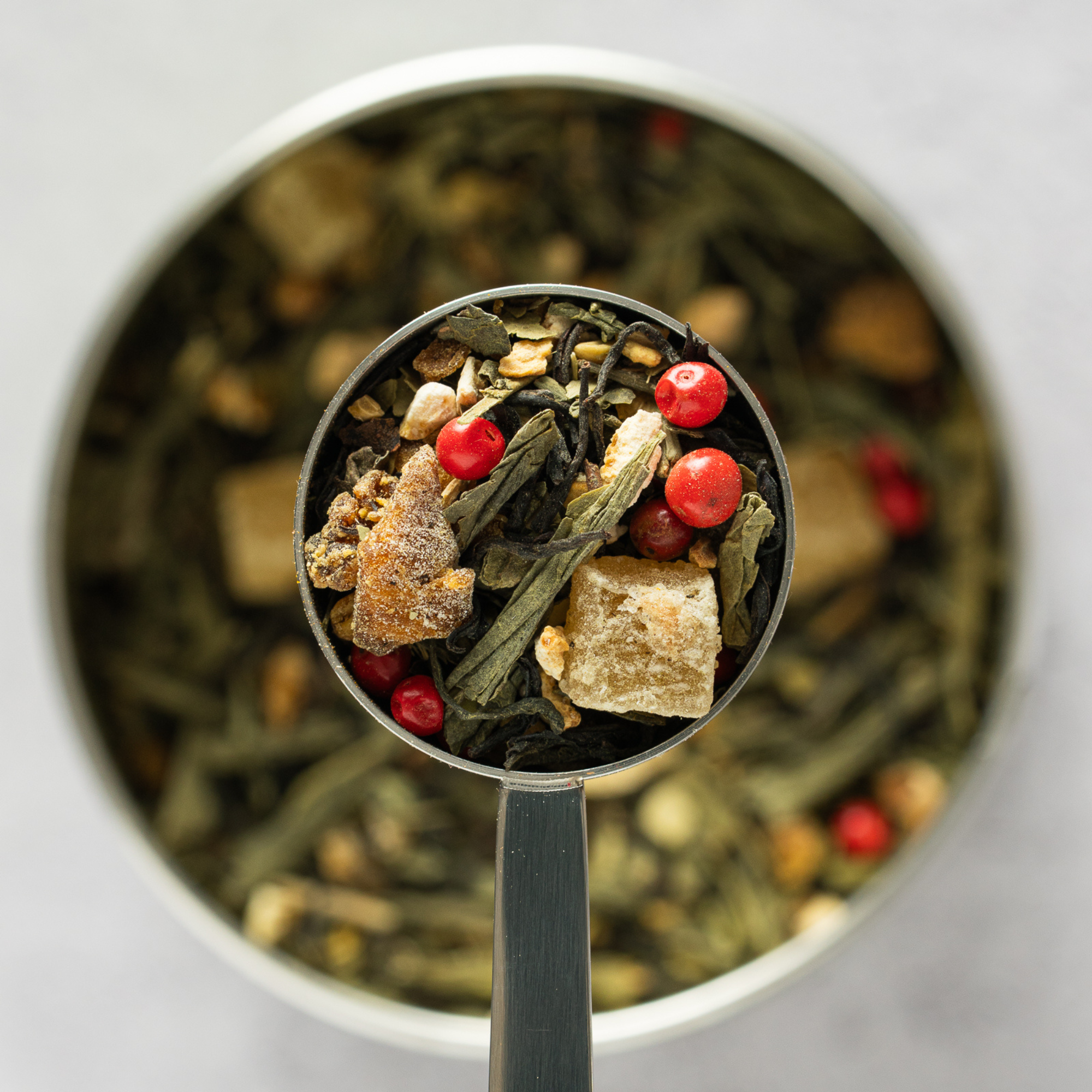 Close up of Maximum Velocitea loose leaf tea with ginger, mango and pink peppercorn