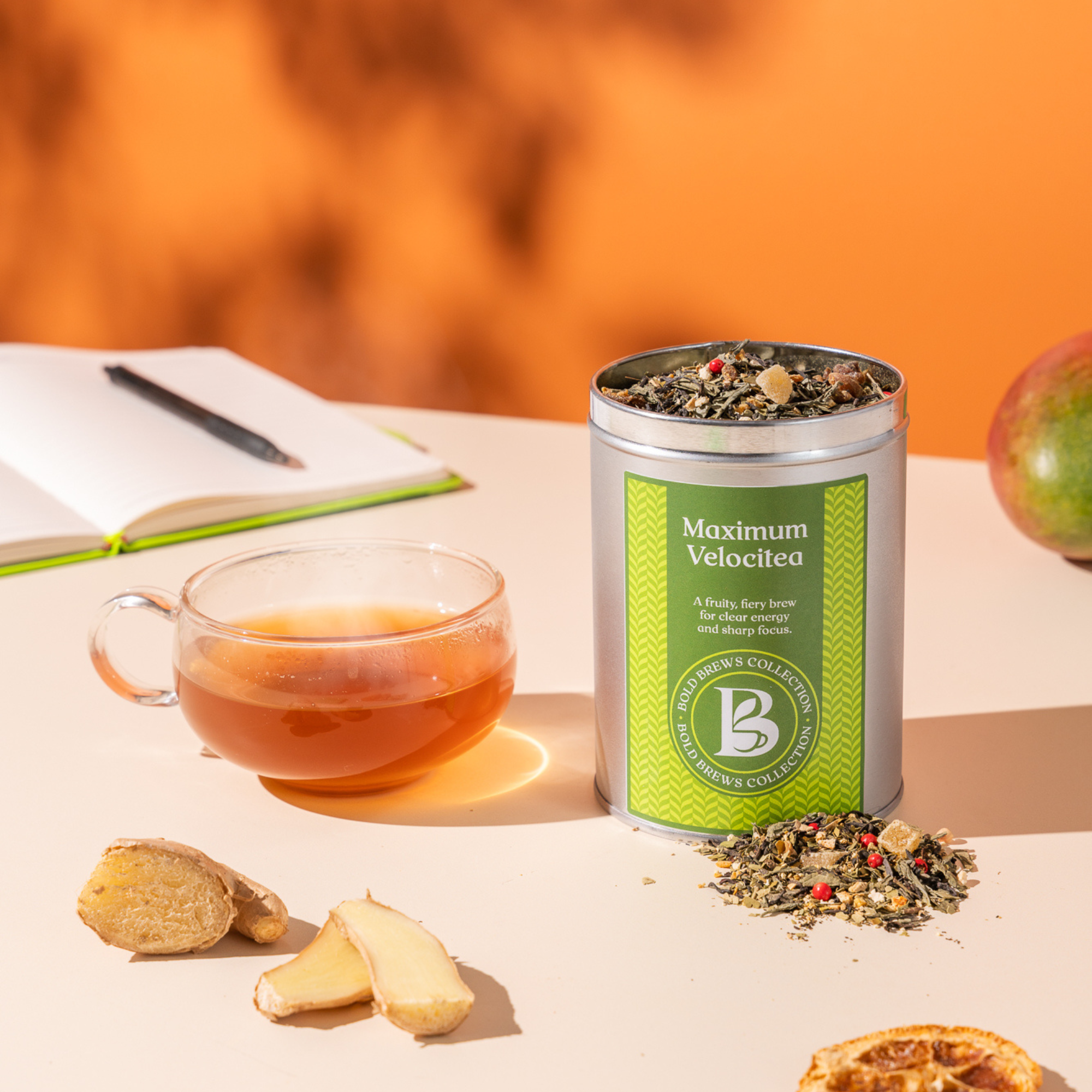Maximum Velocitea loose leaf energy tea with glass cup and ginger for busy mornings
